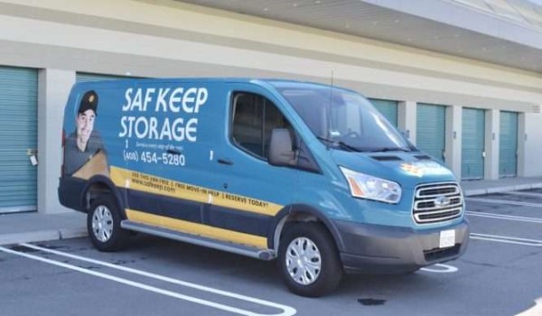 Saf Keep Storage moving van parked in front of storage units