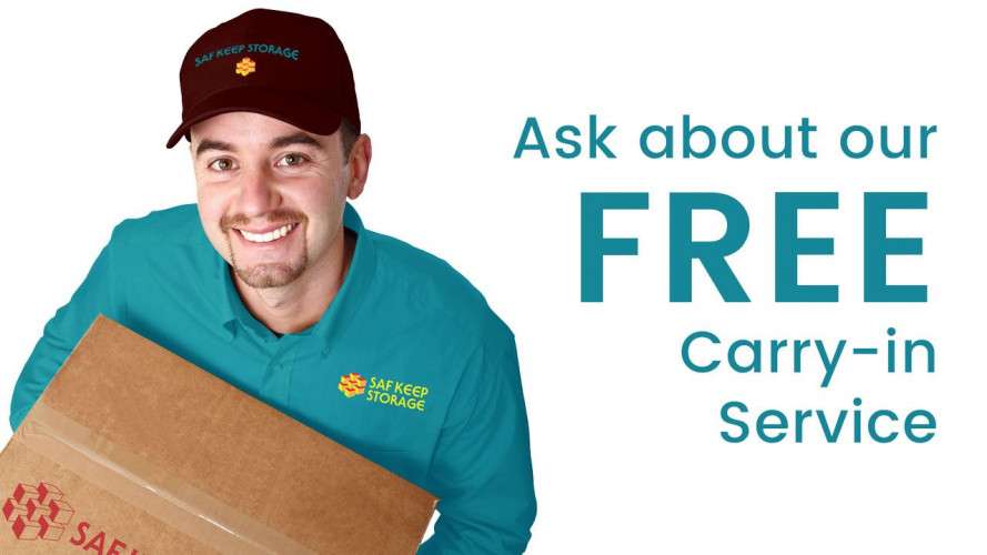 Man holding box with text that says ask about our free carry in service