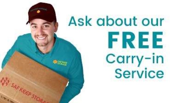 man holding box next to text that says ask us about our free carryin service