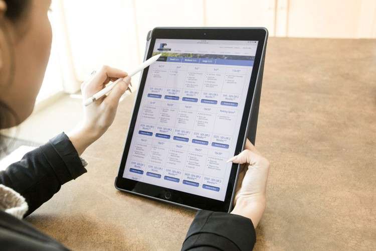 woman viewing self storage options on a tablet