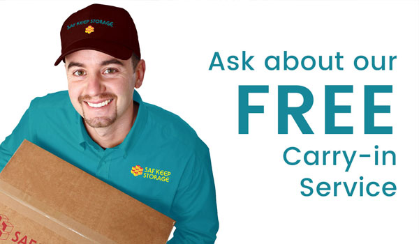 man holding box with text that says ask about our free carryin service