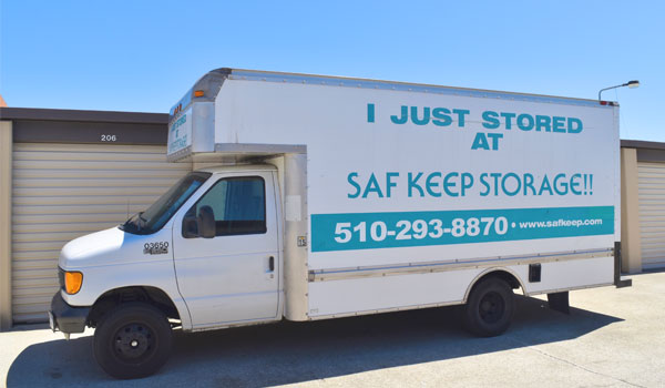 moving truck outside of storage units with text I just storage at Saf Keep Storage 5102938870 wwwsafkeepcom