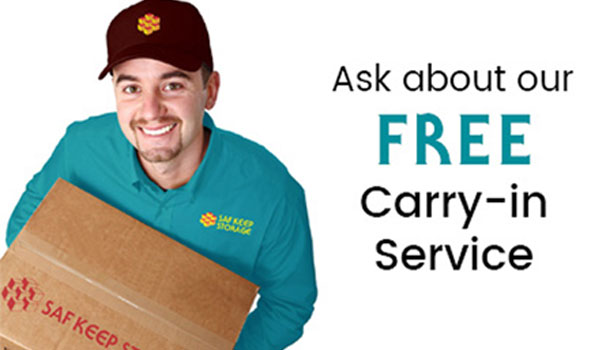 man holding box with text that says ask about our free carryin service